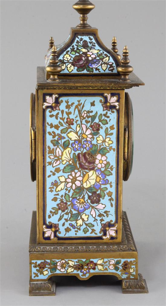 An early 20th century bronze and champleve enamel clock garniture, 8in.